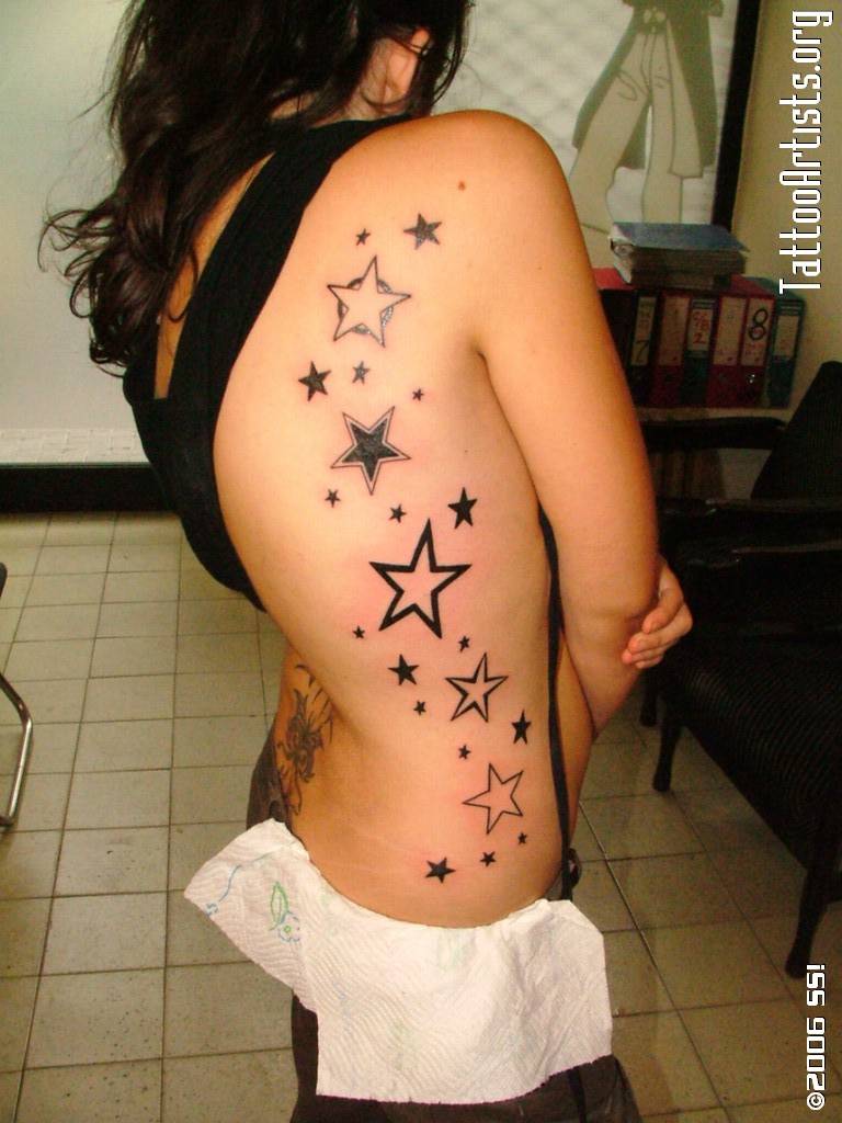 Photo:  women-side-rib-stars-tattoo